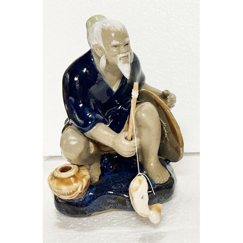 Pêcheur vietnamien en pierre taillée