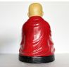 Statue de moine et son bol à obole en prière sous un mandala du Népal
